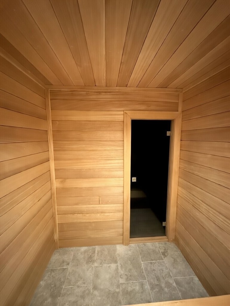 Ambara sauna interior showing benches and door