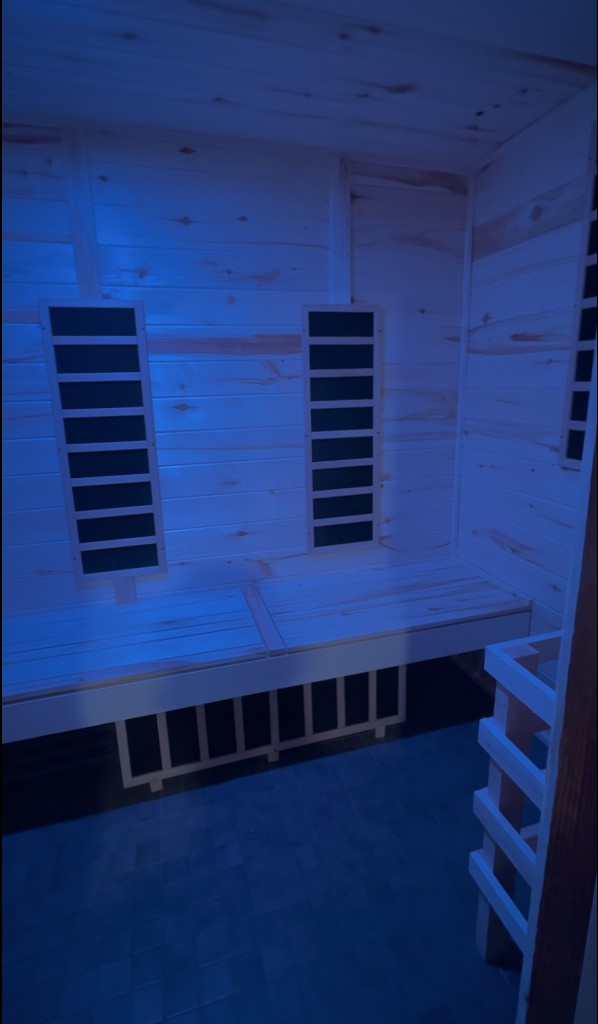 Aspen sauna interior illuminated with blue light therapy