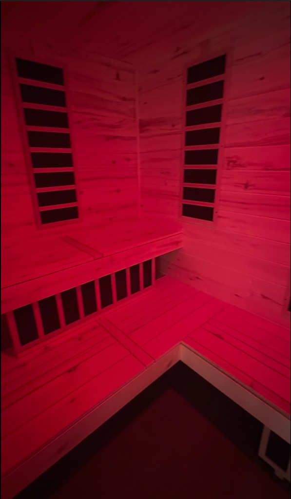 Aspen sauna interior illuminated with red light therapy